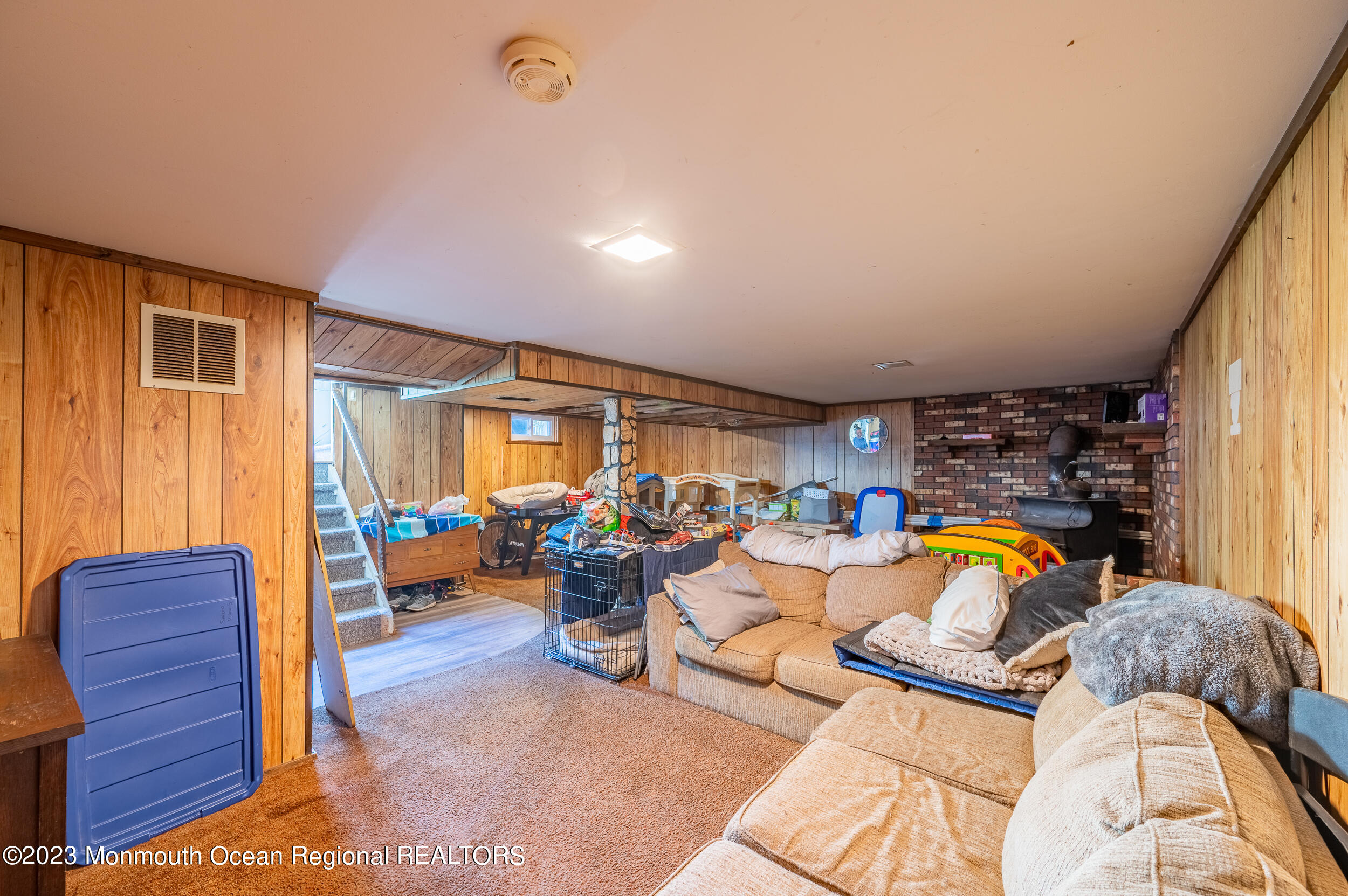 3 Amherst Road Toms River, NJ 08757 - Photo 15 of 19 a living room with lots of furniture and gym equipment