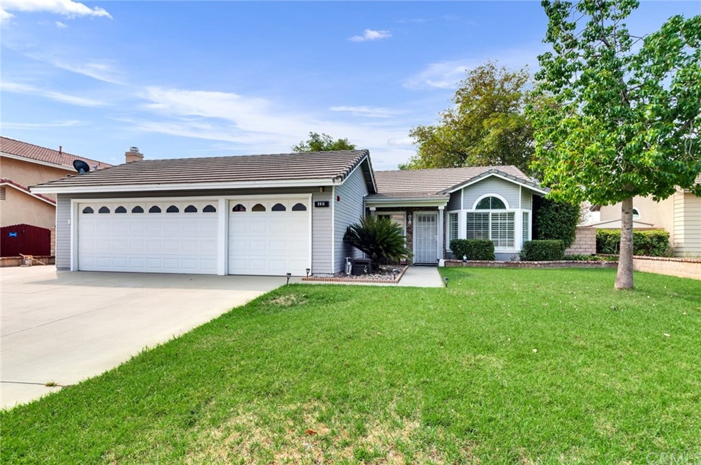 2815 West Fairview Drive Rialto, CA 92377 - Photo 1 of 1 a front view of a house with a yard