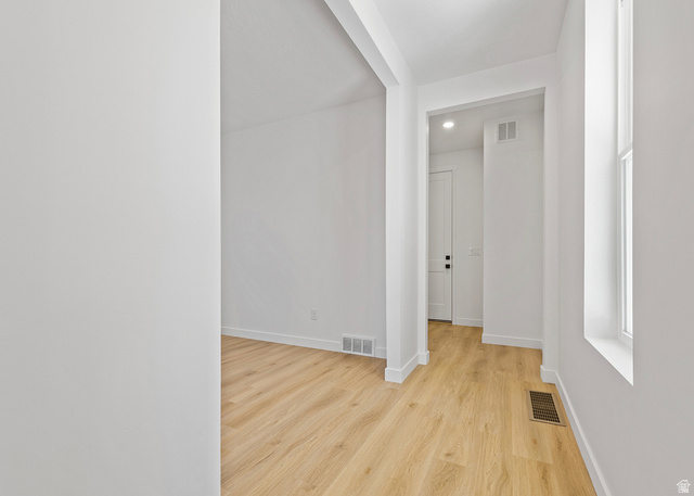 11214 South Easy Bee Road, Unit 270 South Jordan, UT 84009 - Photo 11 of 31 Entryway featuring wood-finish flooring, crisp white walls, and a recessed window