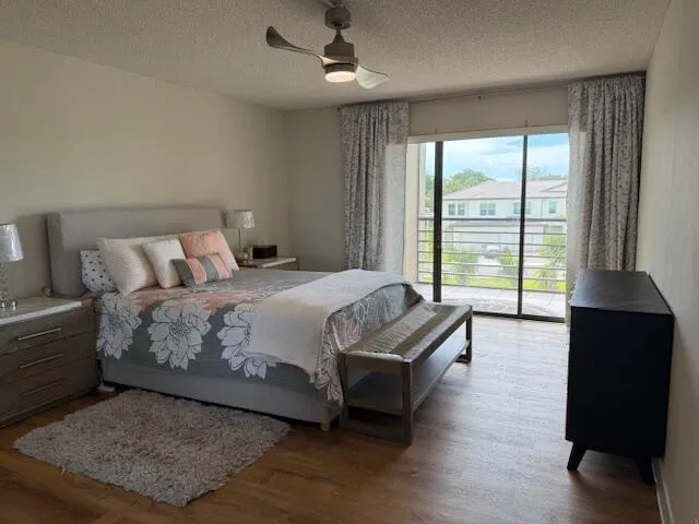 a spacious bedroom with a bed and a large window