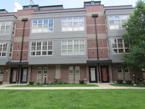 a view of a building with a yard