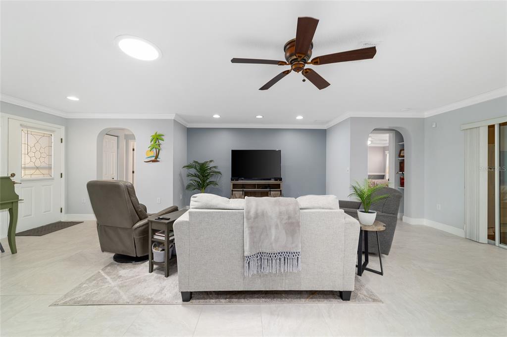 8125 South W 81st Loop Ocala, FL 34476 - Photo 12 of 58 a living room with furniture and a flat screen tv