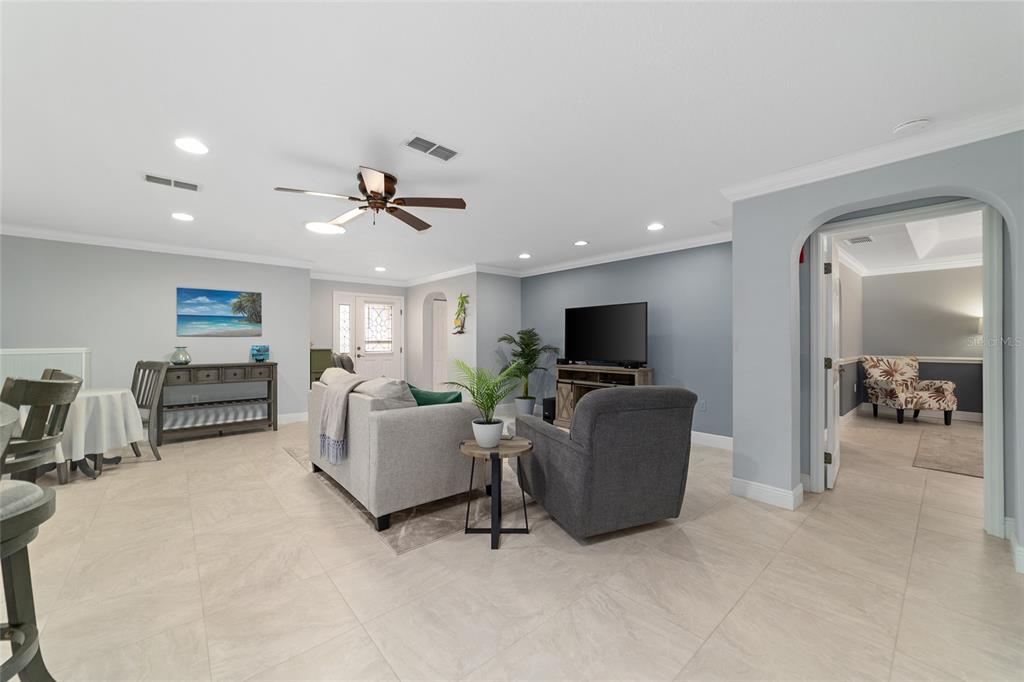 8125 South W 81st Loop Ocala, FL 34476 - Photo 14 of 58 a living room with furniture and a flat screen tv