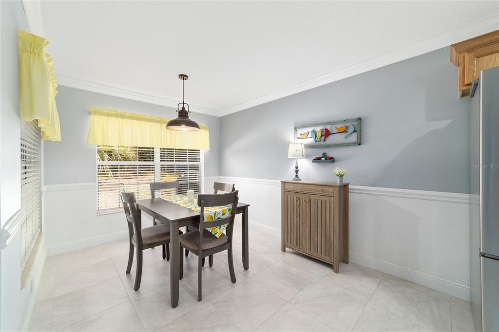 8125 South W 81st Loop Ocala, FL 34476 - Photo 28 of 58 a view of a dining room with furniture and window