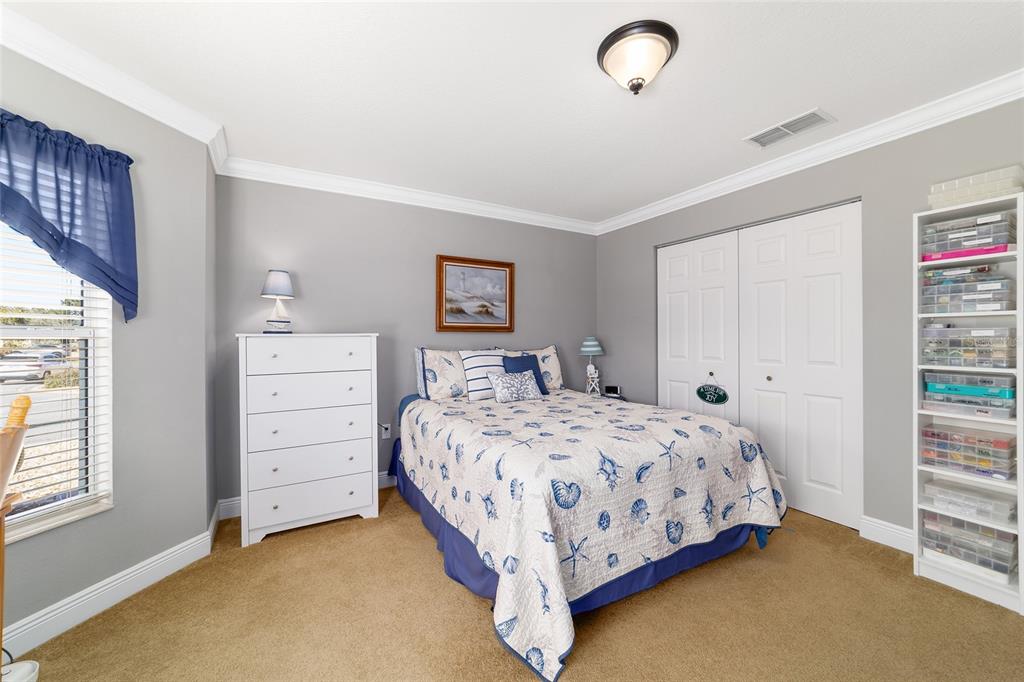 8125 South W 81st Loop Ocala, FL 34476 - Photo 41 of 58 a bedroom with a bed and a window