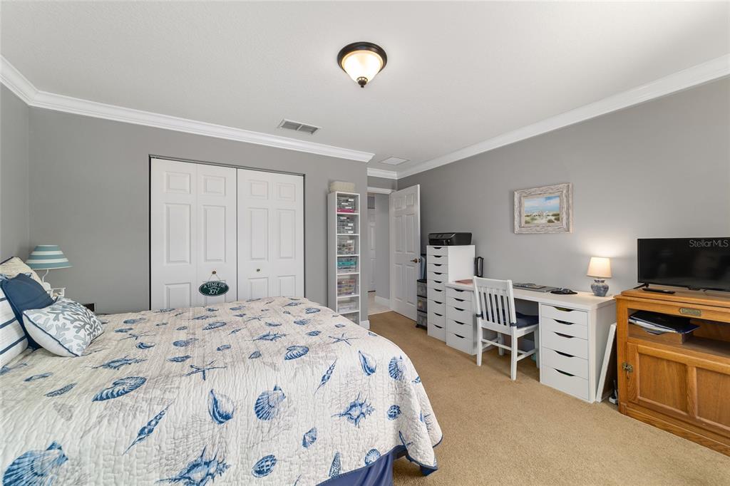 8125 South W 81st Loop Ocala, FL 34476 - Photo 42 of 58 a bedroom with a bed and furniture