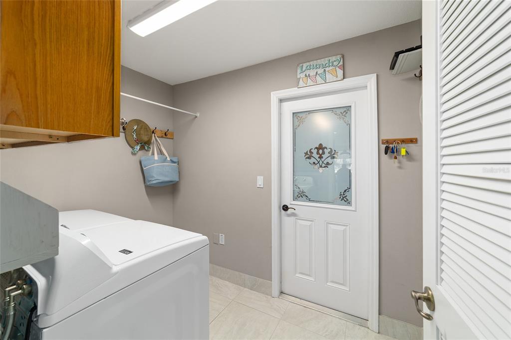 8125 South W 81st Loop Ocala, FL 34476 - Photo 43 of 58 a hallway with washer and dryer