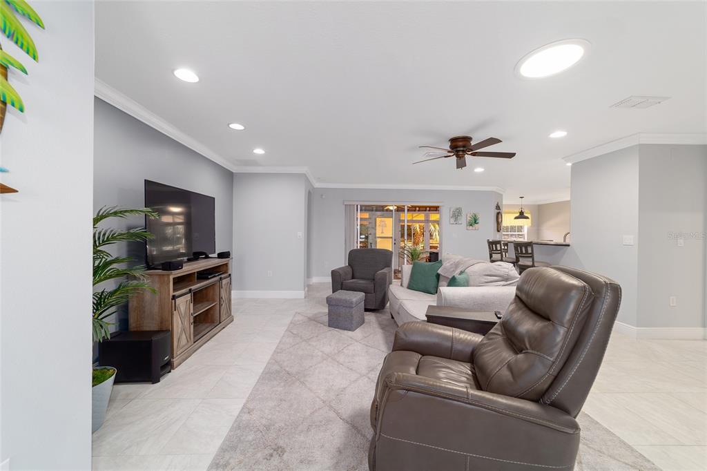 8125 South W 81st Loop Ocala, FL 34476 - Photo 9 of 58 a living room with furniture and a flat screen tv