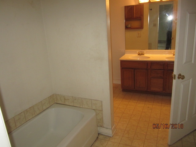 515 Ridge Street Charlottesville, VA 22902 - Photo 15 of 15 a bathroom with a tub sink and mirror