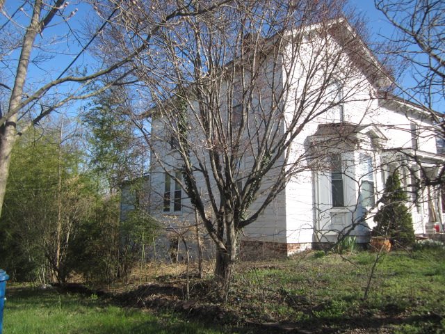 515 Ridge Street Charlottesville, VA 22902 - Photo 2 of 15 a view of white house with a yard and large trees