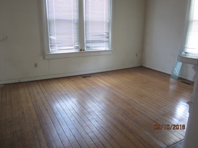 515 Ridge Street Charlottesville, VA 22902 - Photo 6 of 15 an empty room with wooden floor and windows