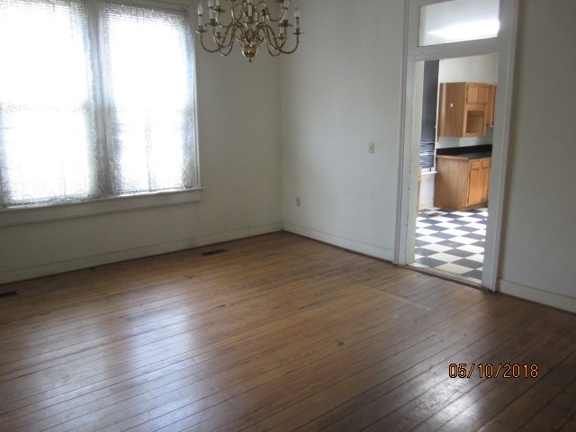 515 Ridge Street Charlottesville, VA 22902 - Photo 7 of 15 an empty room with wooden floor and windows