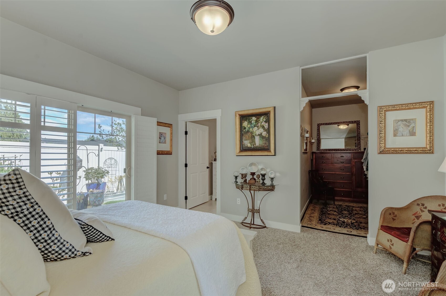 227 Pershing Circle Wenatchee, WA 98801 - Photo 18 of 38 a bedroom with a bed a dresser and next to a window