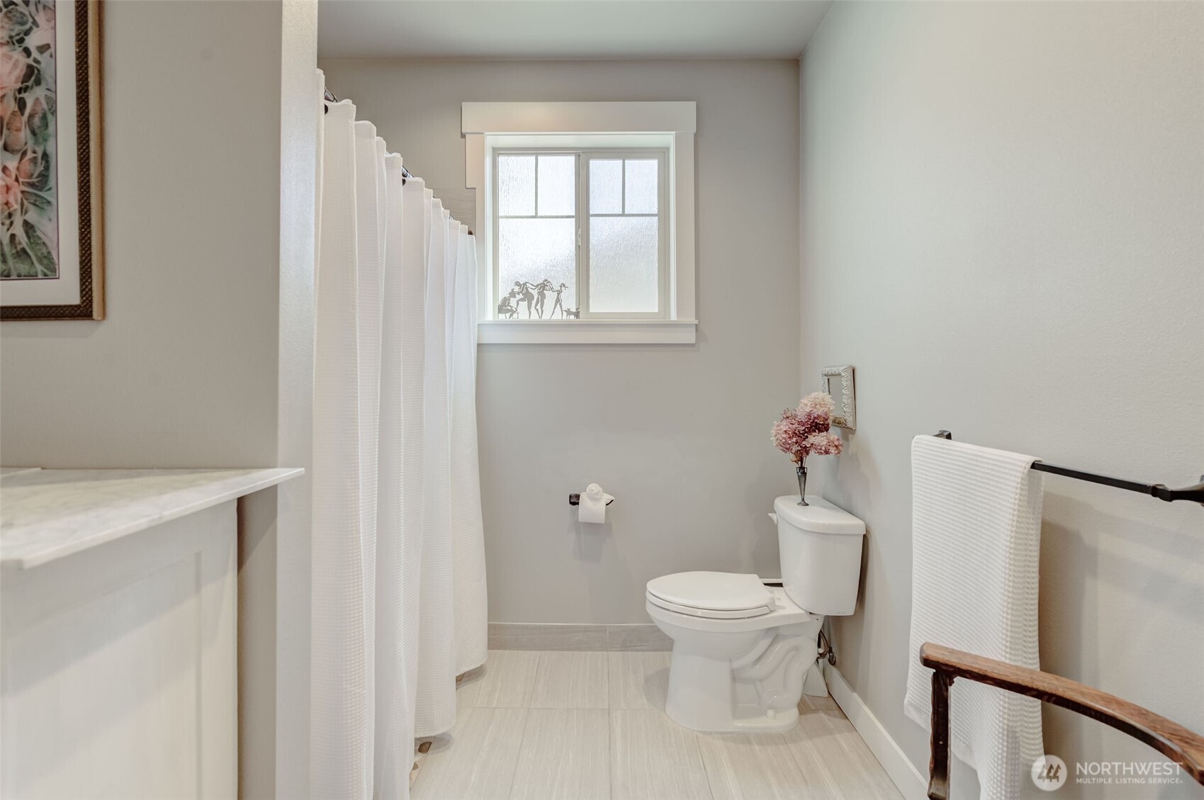 227 Pershing Circle Wenatchee, WA 98801 - Photo 19 of 38 a white toilet sitting next to a bathroom sink