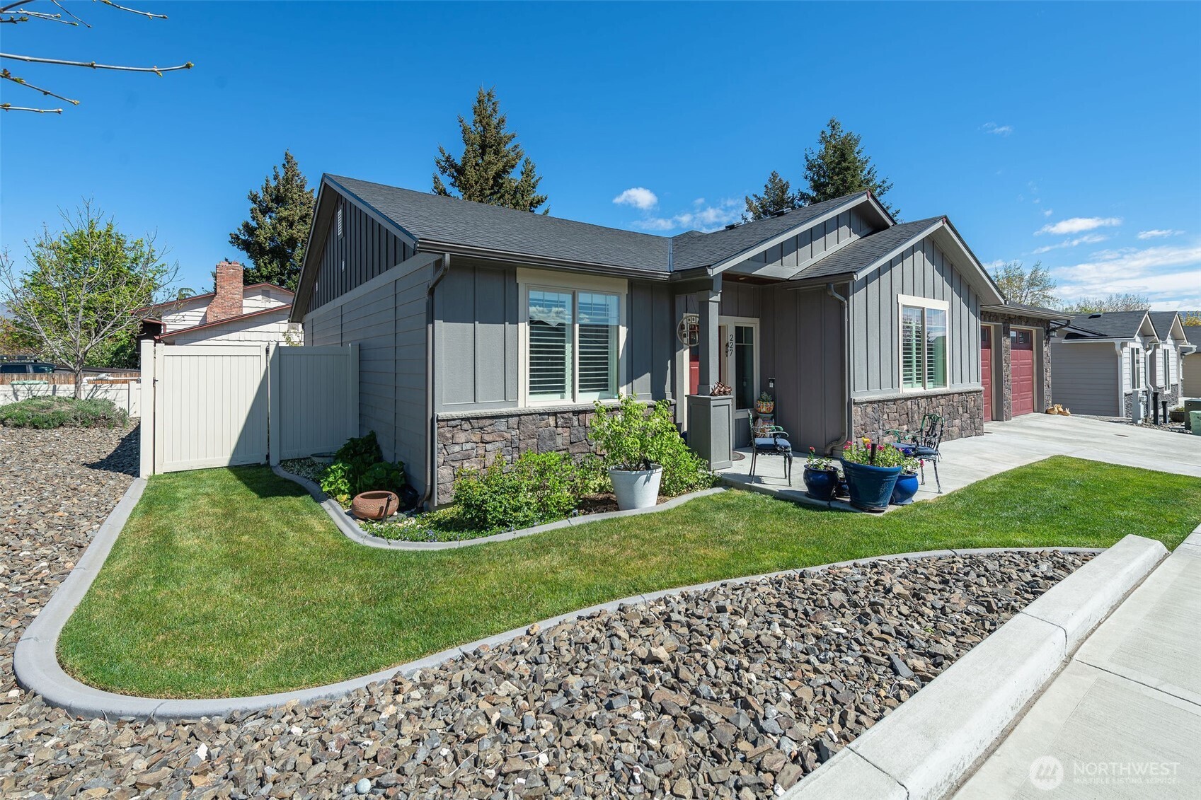 227 Pershing Circle Wenatchee, WA 98801 - Photo 5 of 38 a front view of a house with a yard