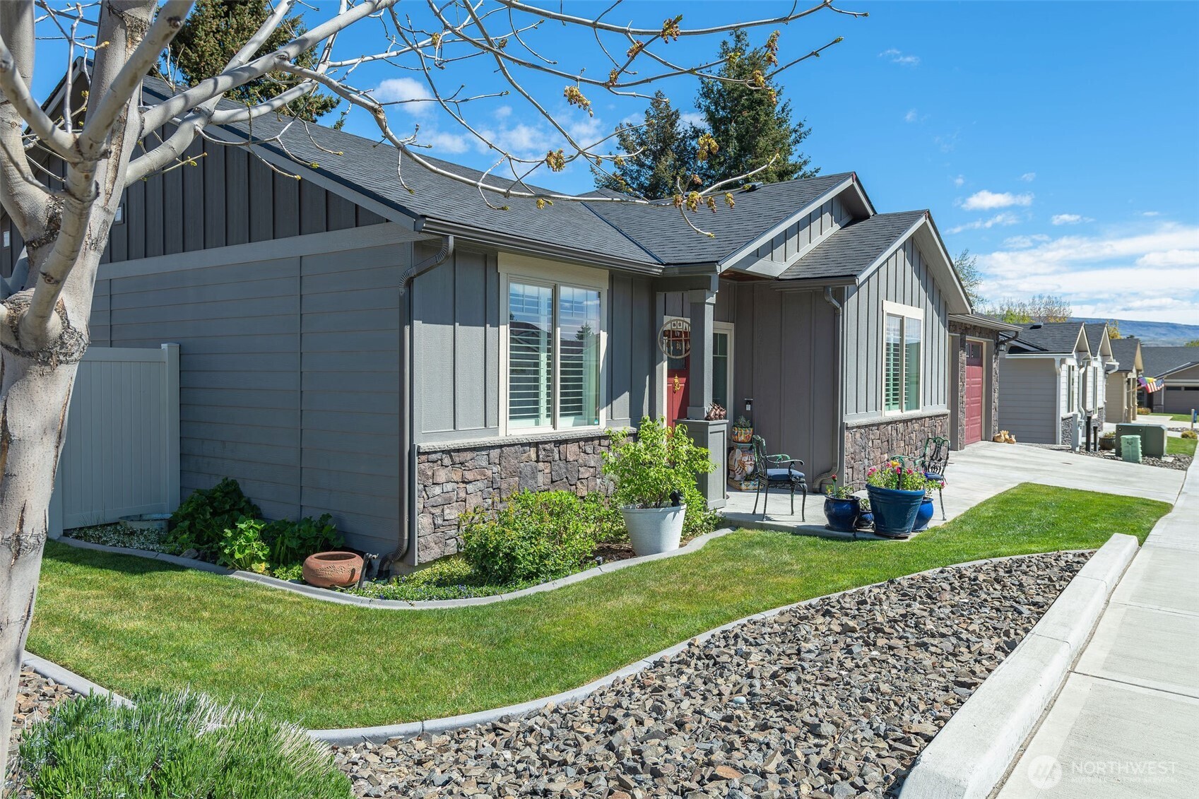 227 Pershing Circle Wenatchee, WA 98801 - Photo 6 of 38 a front view of a house with a yard