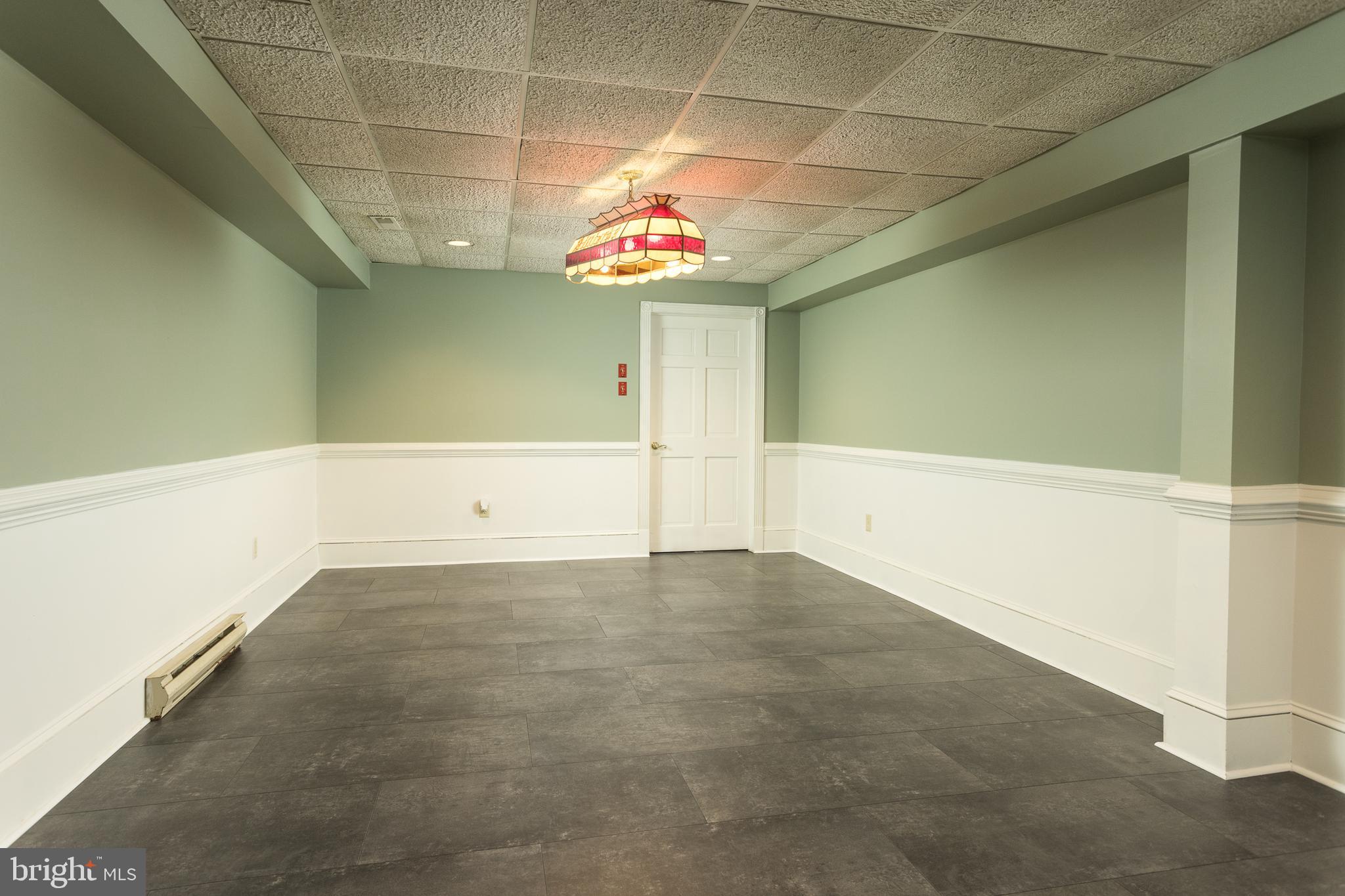 3040 Oak Farm Road Churchville, MD 21028 - Photo 35 of 51 LOWER LEVEL REC ROOM W/LUXURY VINYL FLOORING