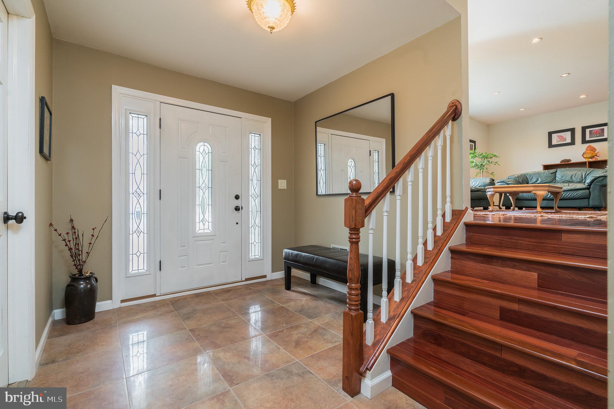 14 Azalea Way Hamilton, NJ 08690 - Photo 2 of 33 a view of entryway with wooden floor and stairs