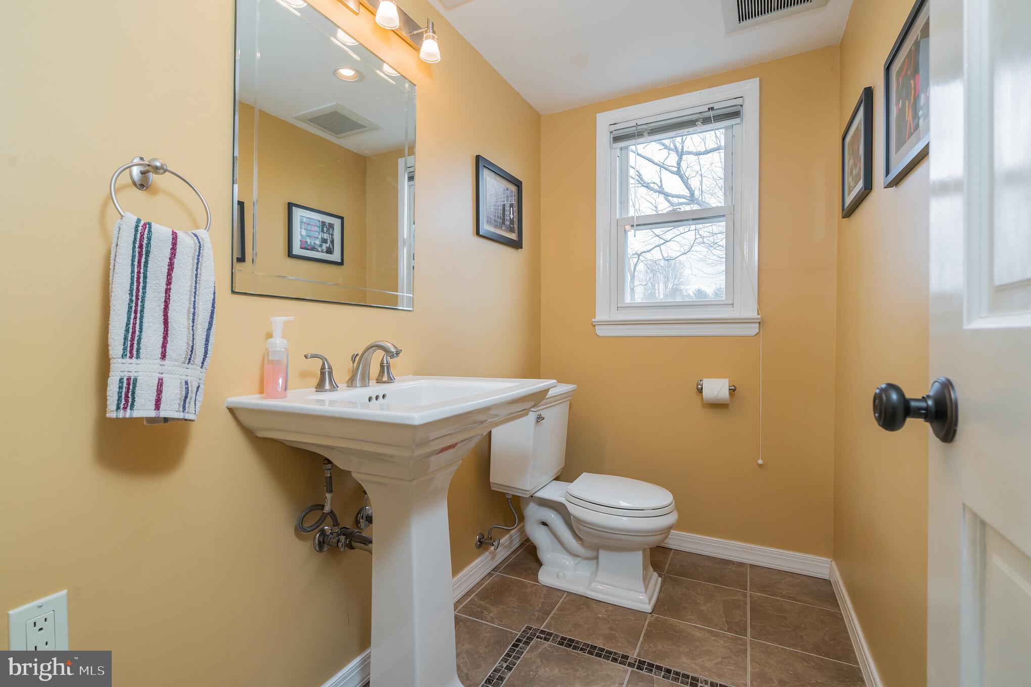 14 Azalea Way Hamilton, NJ 08690 - Photo 16 of 33 a bathroom with a sink and mirror with toilet