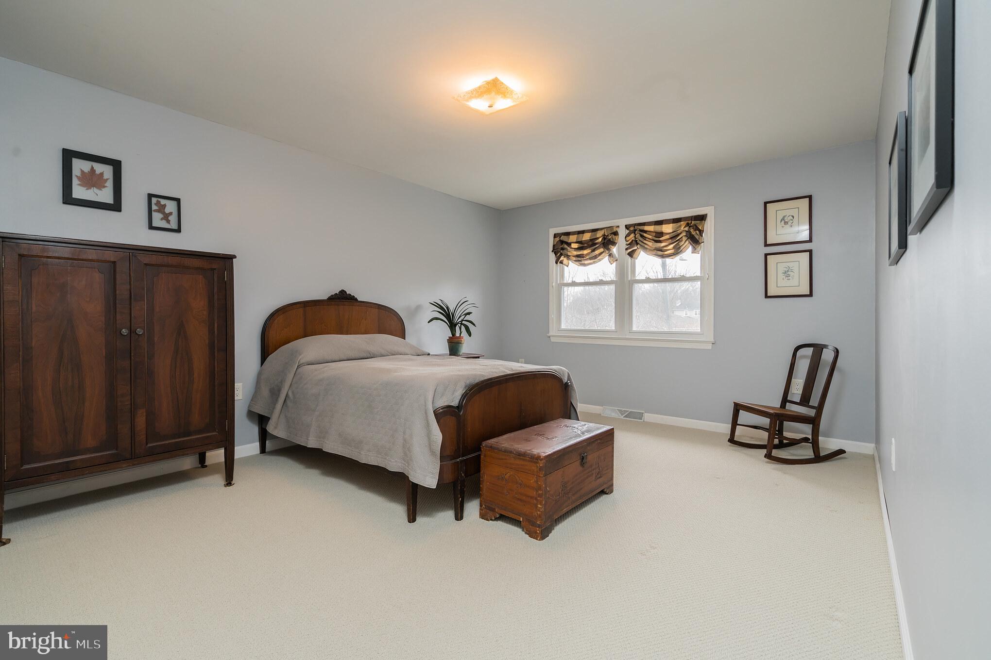 14 Azalea Way Hamilton, NJ 08690 - Photo 24 of 33 a bedroom with a bed a couch and a window