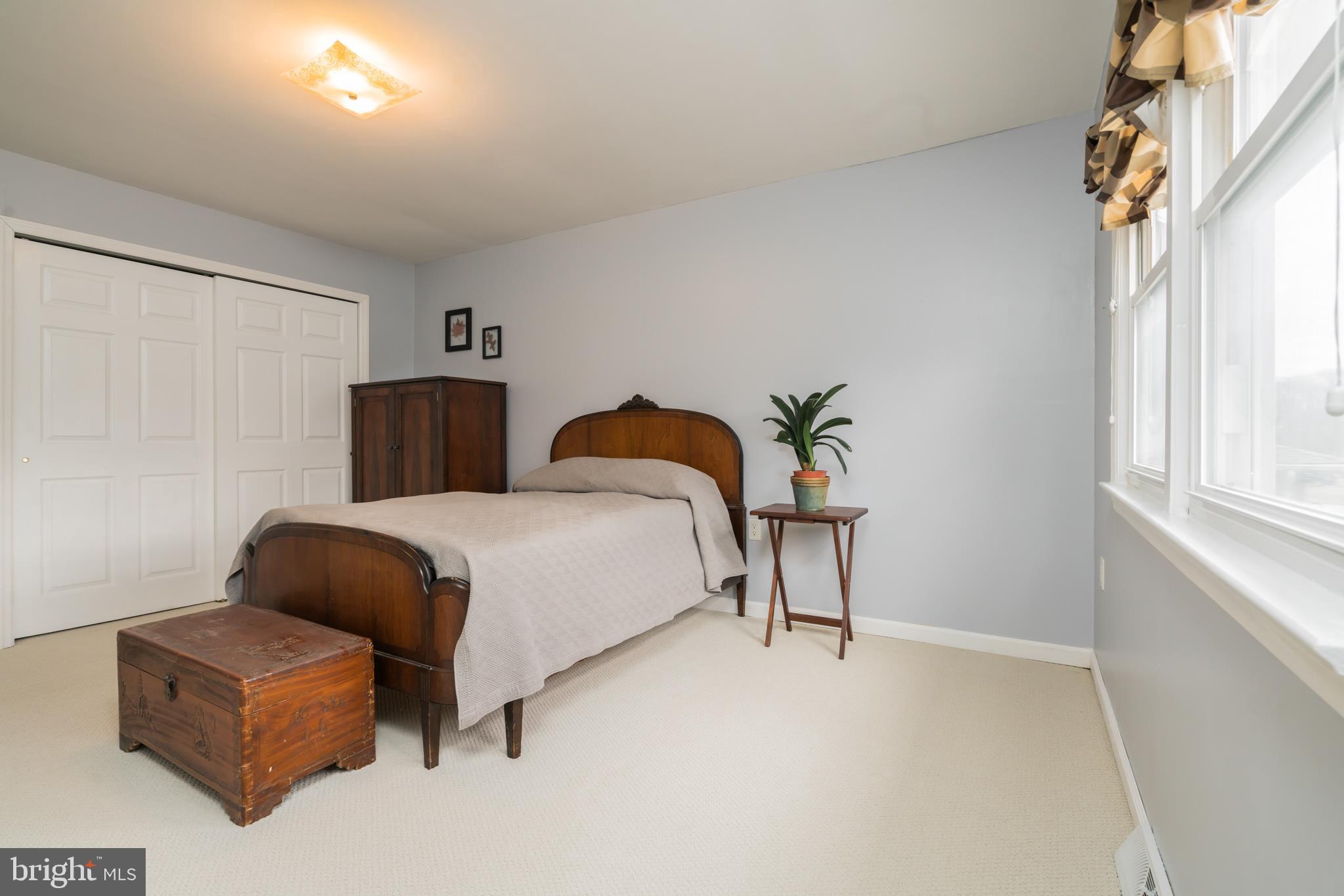 14 Azalea Way Hamilton, NJ 08690 - Photo 25 of 33 a bedroom with a bed and a couch