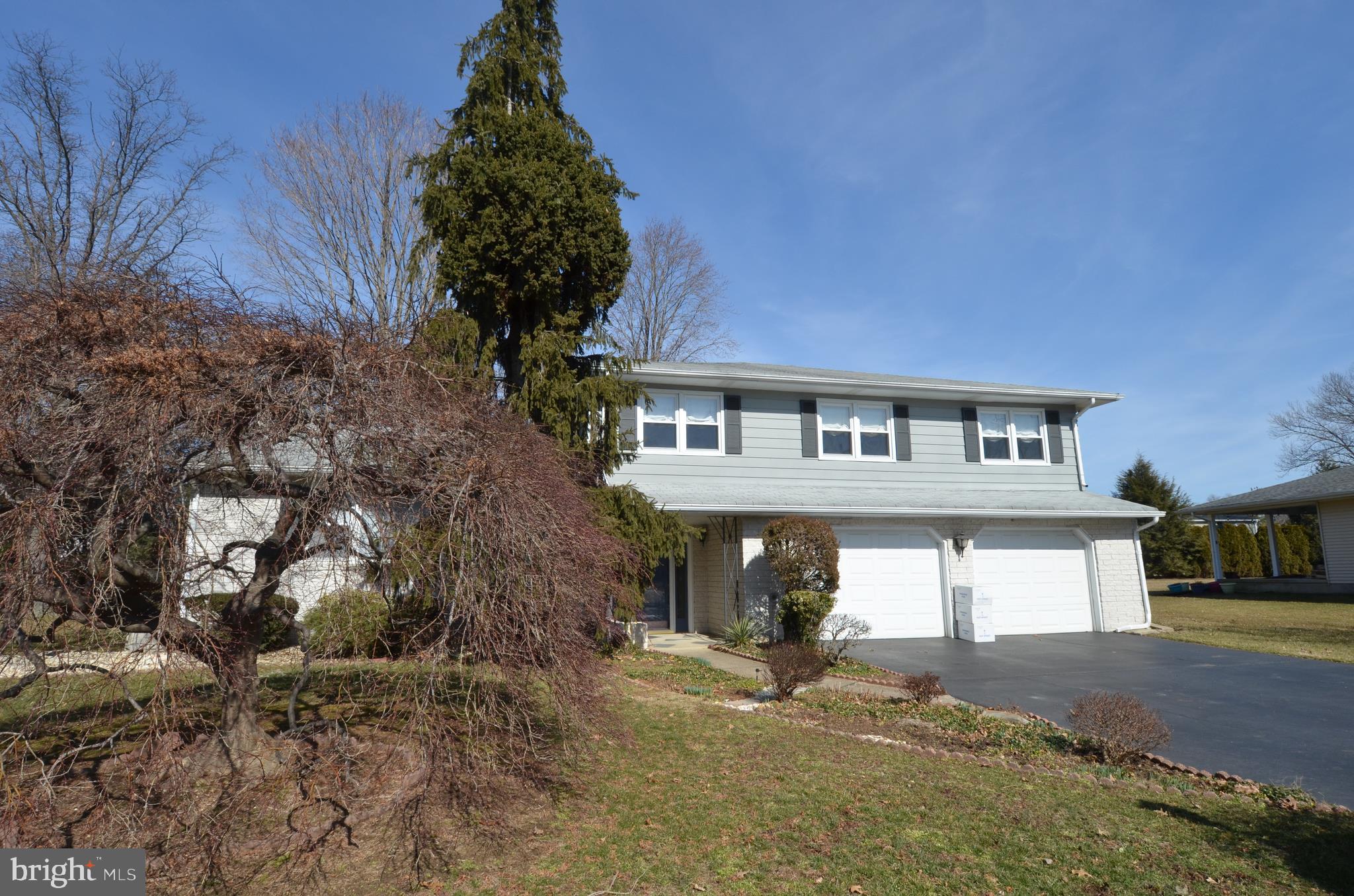 14 Azalea Way Hamilton, NJ 08690 - Photo 30 of 33 a front view of a house with a yard and garage