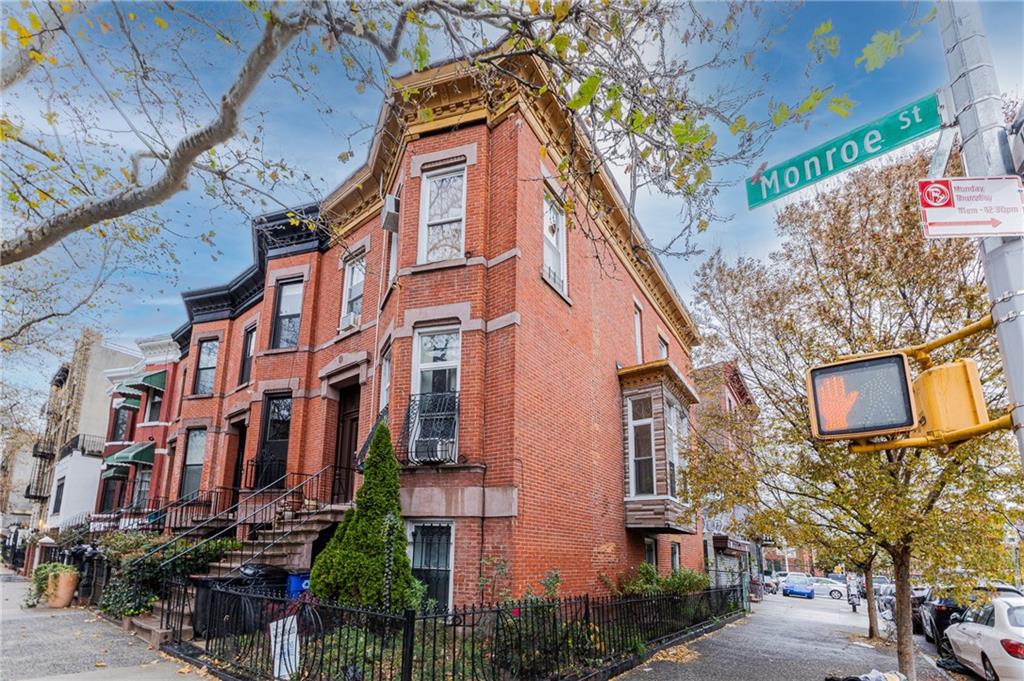 a view of a building with a street
