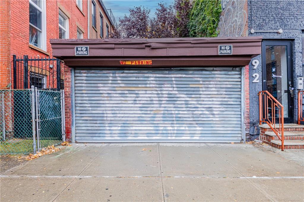 399 Monroe Street Brooklyn, NY 11221 - Photo 3 of 6 a view of a brick house with a street