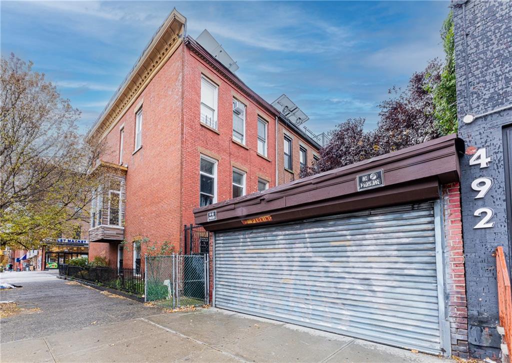 399 Monroe Street Brooklyn, NY 11221 - Photo 4 of 6 a view of a house with a street