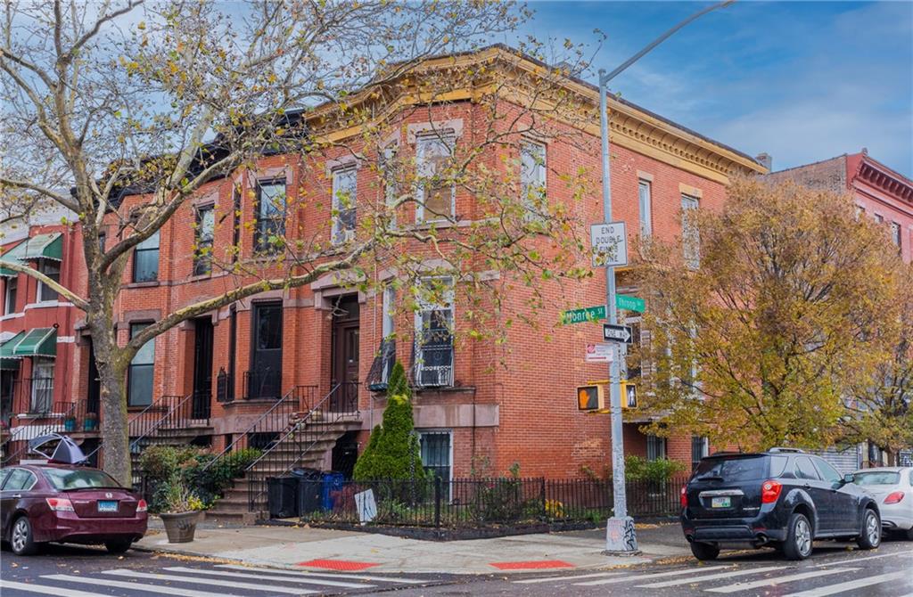 399 Monroe Street Brooklyn, NY 11221 - Photo 6 of 6 a car parked in front of a building