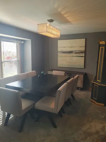 a kitchen with stainless steel appliances granite countertop a refrigerator and a stove