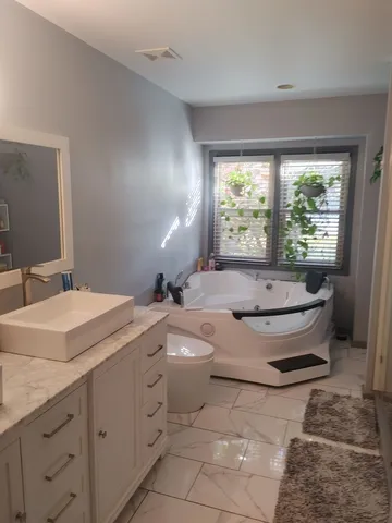 a bathroom with a toilet and a sink