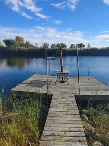 a front view of a house with a garden and yard