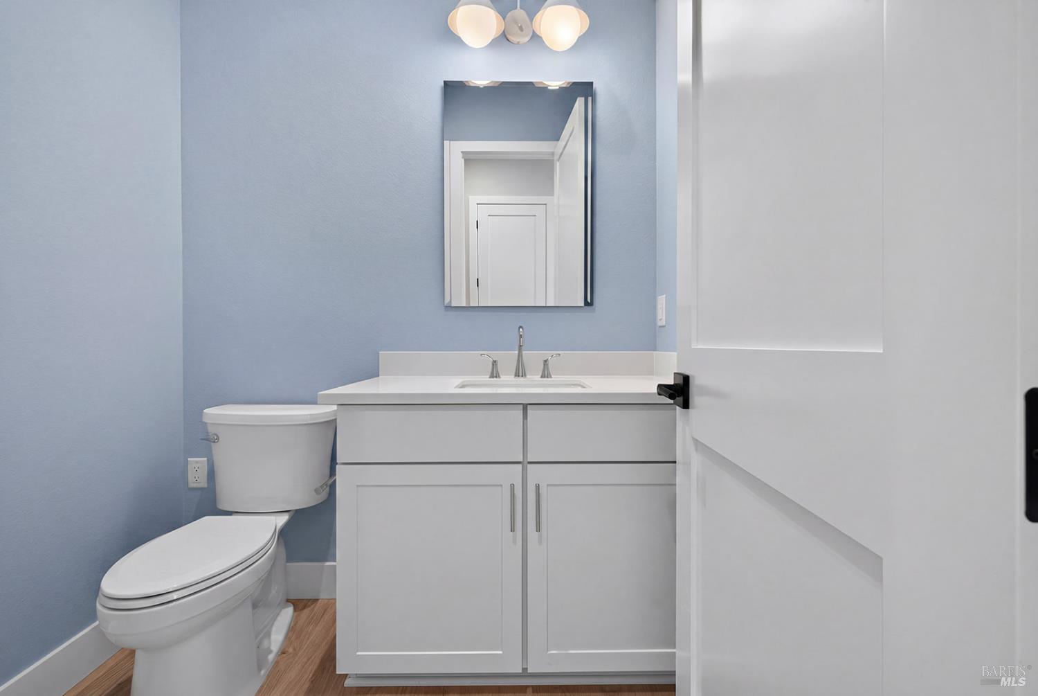 1907 Carlile Place Santa Rosa, CA 95403 - Photo 19 of 55 Here is the main level powder room located in the hallway leading to the 3-car tandem garage and one of two primary suites this home offers.