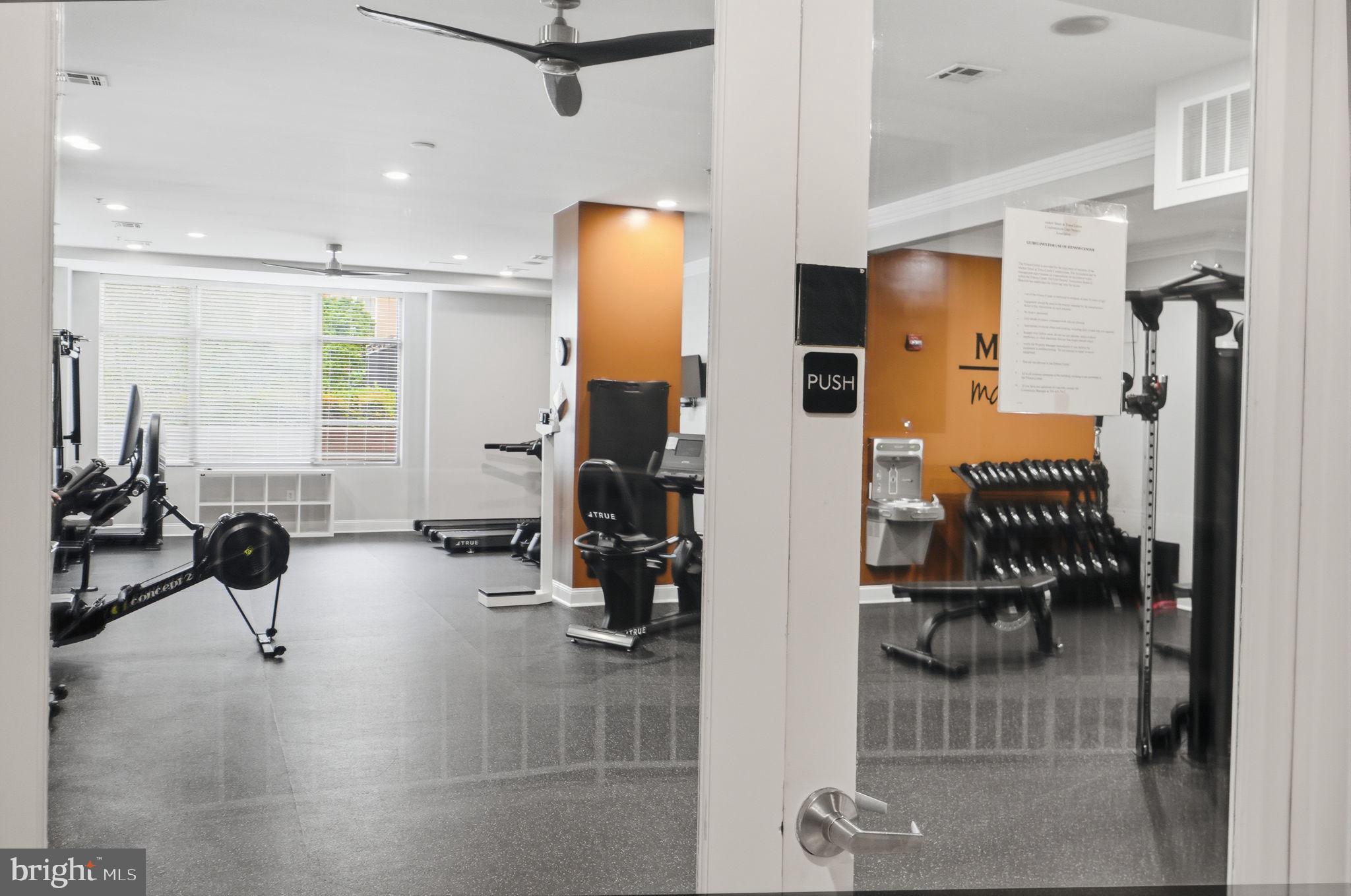 12001 Market Street, Unit 140 Reston, VA 20190 - Photo 29 of 48 Modern fitness center with sleek design.