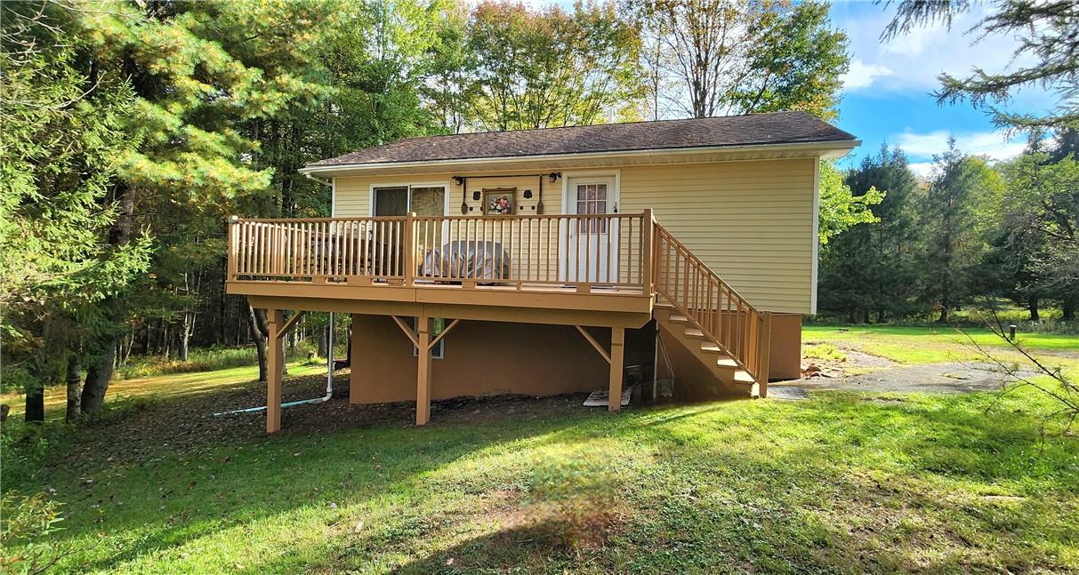 45 Moscoe Road, Unit TR60 White Lake, NY 12786 - Photo 1 of 1 Rear view of property featuring a deck and a yard