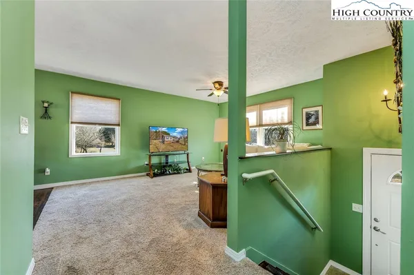 a view of a kitchen with a sink and a window