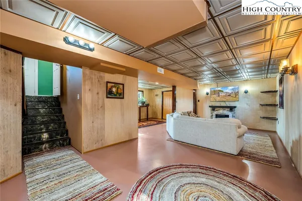 a view of living room with furniture and large window