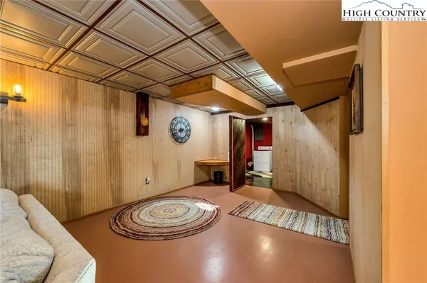 a view of a livingroom with furniture and window