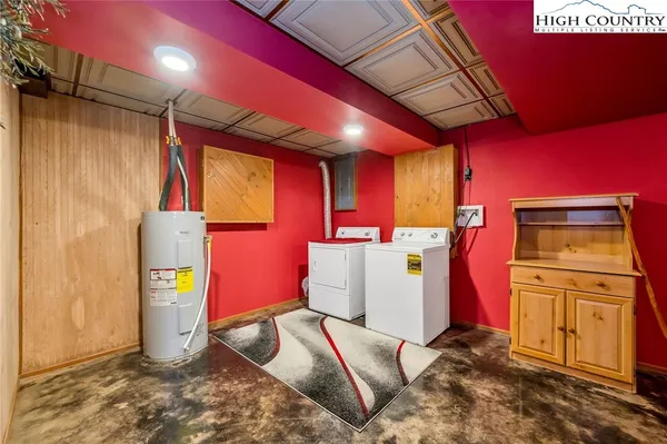 a view of storage and utility room with a refrigerator