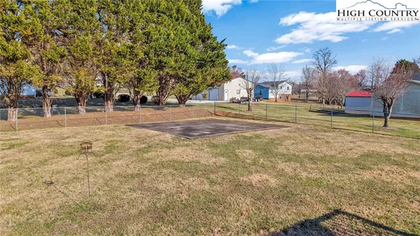 a view of a playground with basketball court