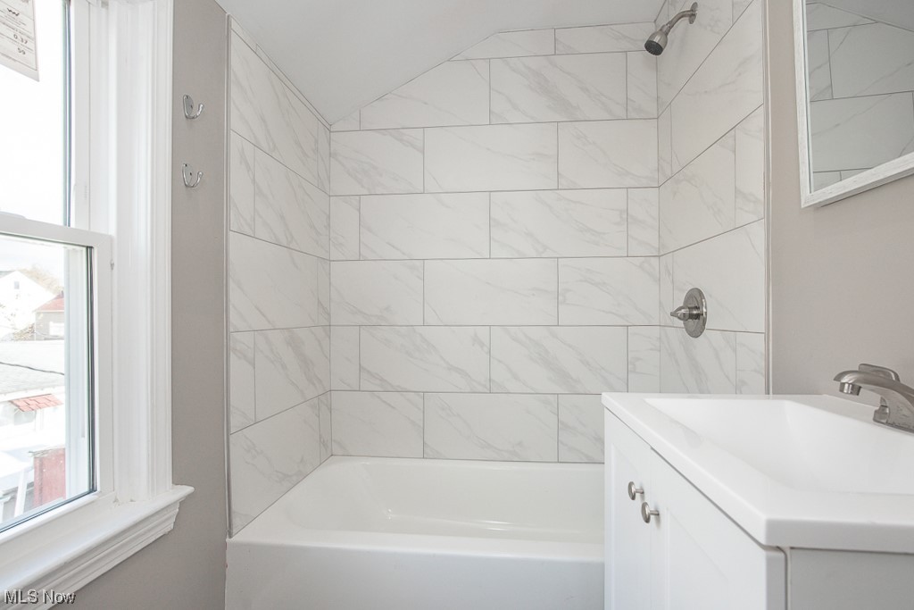 19109 Libby Road Maple Heights, OH 44137 - Photo 18 of 32 Bathroom featuring vanity and tiled shower / bath