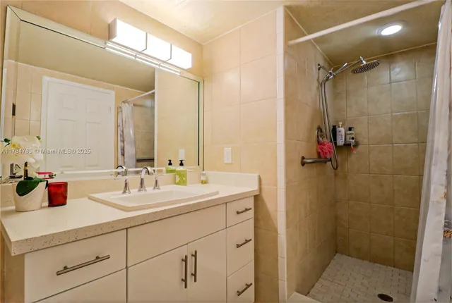 a bathroom with a sink mirror vanity and toilet