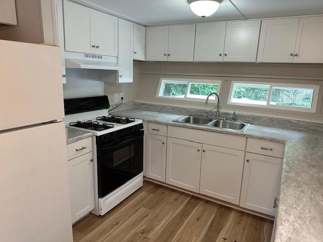 440 Cherry Street Southeast Acworth, GA 30102 - Photo 50 of 73 a kitchen with white cabinets and white appliances