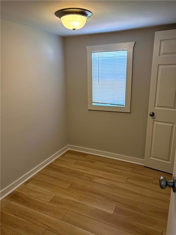 440 Cherry Street Southeast Acworth, GA 30102 - Photo 6 of 73 an empty room with wooden floor and windows