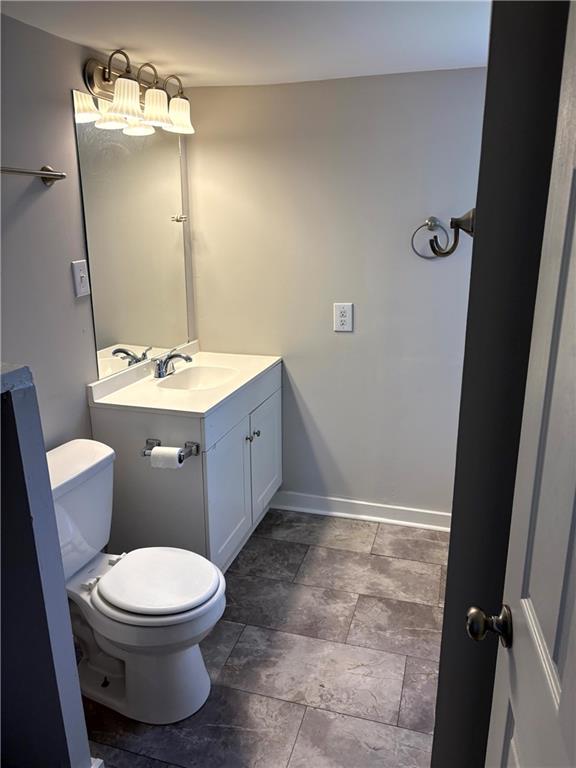 440 Cherry Street Southeast Acworth, GA 30102 - Photo 7 of 73 a bathroom with a toilet a sink and mirror