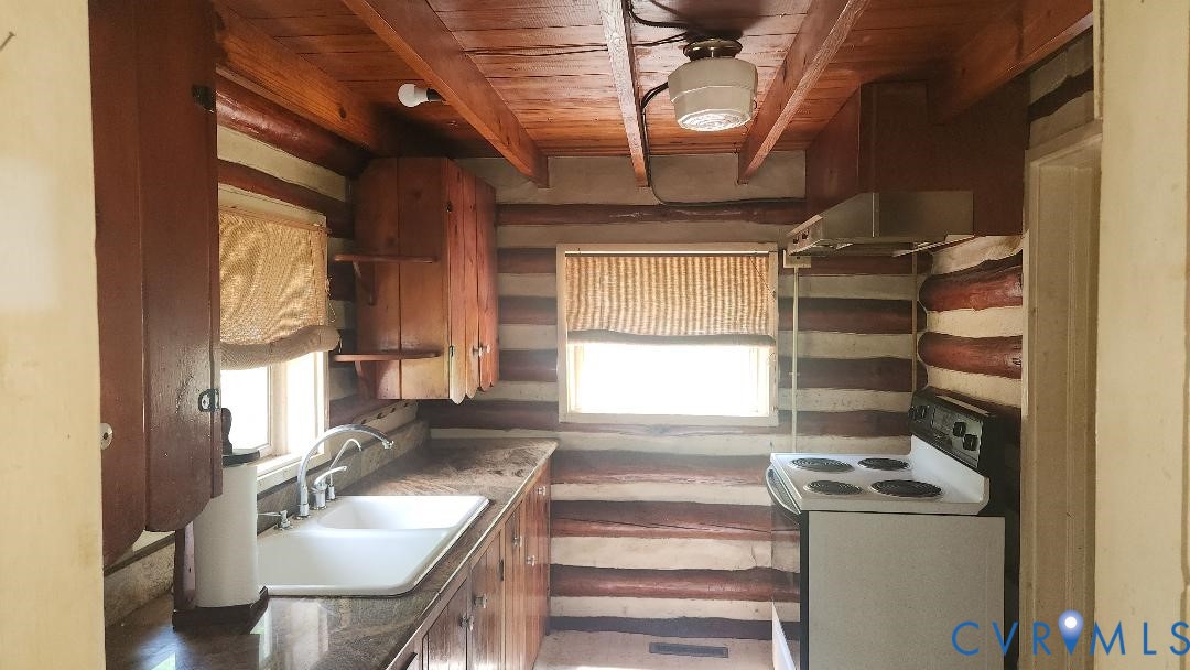 415 Springdale Avenue Colonial Heights, VA 23834 - Photo 7 of 21 a kitchen with a stove a sink and a window