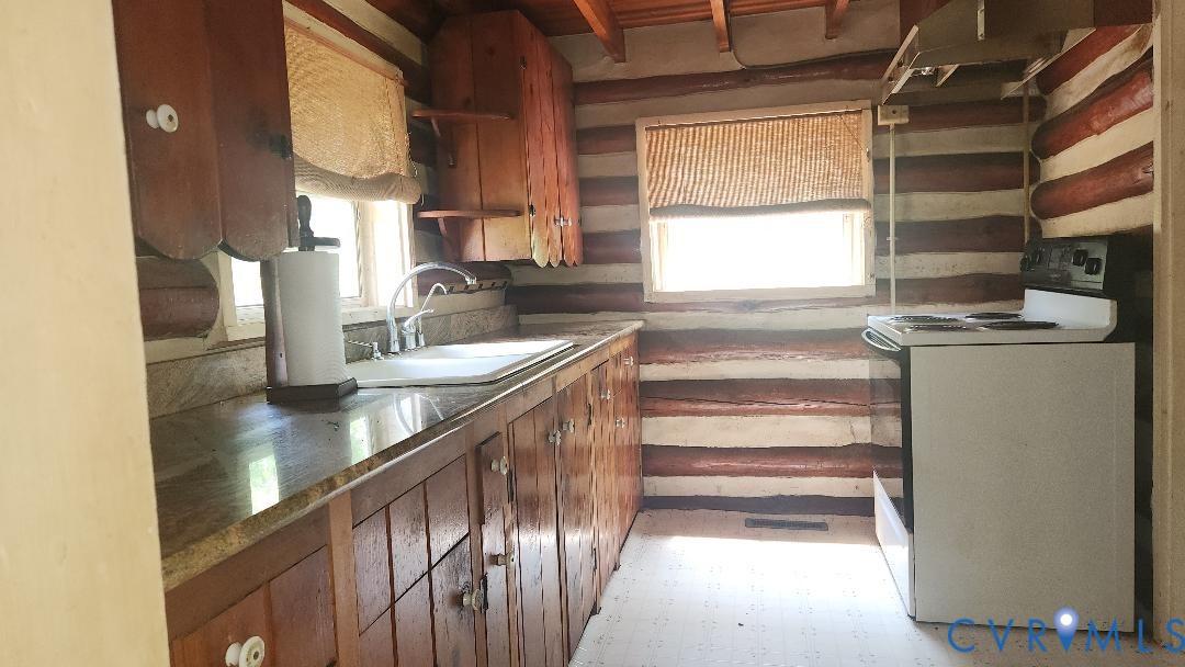415 Springdale Avenue Colonial Heights, VA 23834 - Photo 8 of 21 a kitchen with granite countertop a sink and a window