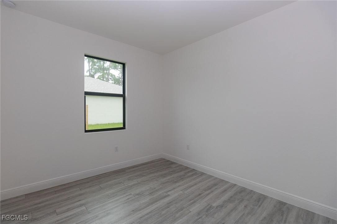 3032 West Briarwood Road LaBelle, FL 33935 - Photo 14 of 23 an empty room with a window