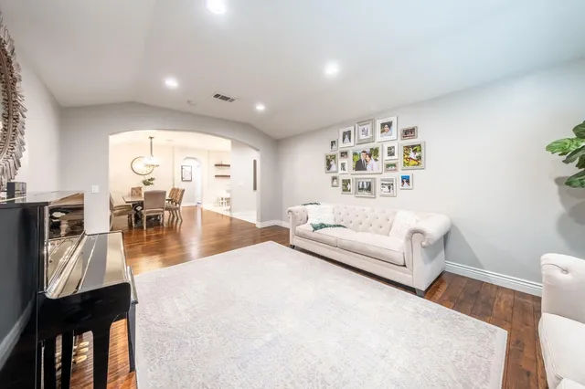 a kitchen with stainless steel appliances granite countertop wooden cabinets a stove top oven a sink and dishwasher